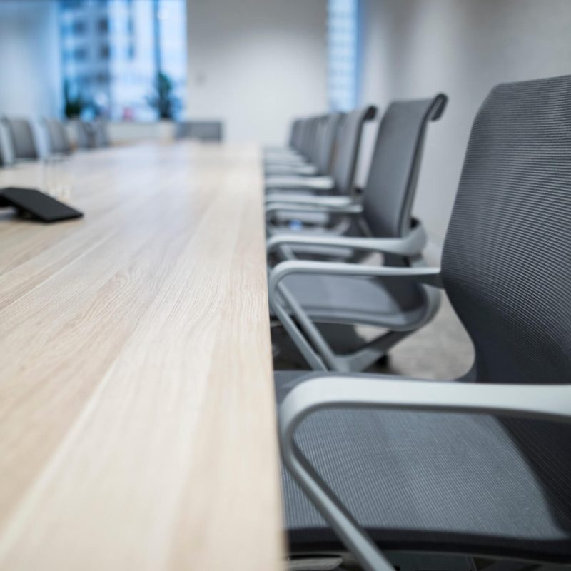 view-of-a-long-board-room-table-with-chairs-against-the-window-which-has-a-view-of-the-sydney-office_t20_kob6Ep.jpg